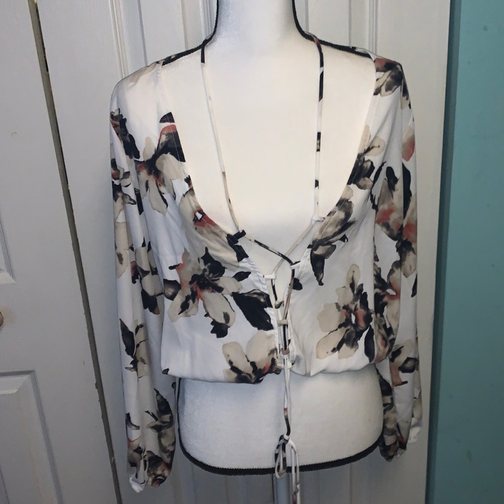 Floral strap closure front long sleeve crop by Fashion Nova